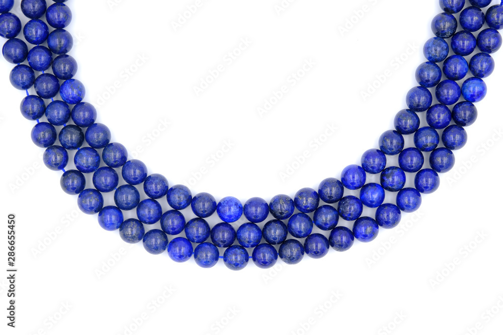 3 layer of blue lapis lazuli natural stone necklace isolated on white background 3 layer of blue lapis lazuli natural stone necklace isolated on white background