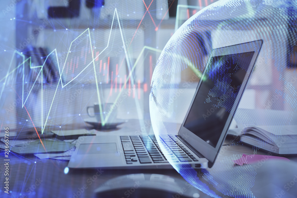 Forex market graph hologram and personal computer on background. Multi exposure. Concept of investment. Forex market graph hologram and personal computer on background. Multi exposure. Concept of investment.
