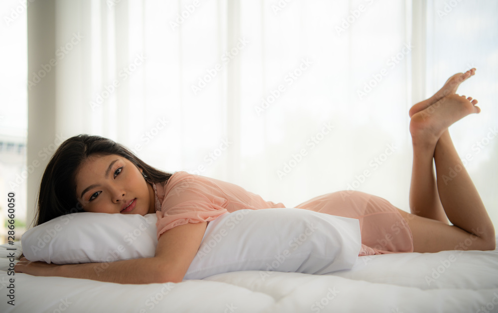 Beautiful sexy lady. Fashion portrait of model in studio. Beauty women with attractive bodies in pink pajamas. Beautiful sexy lady. Fashion portrait of model in studio. Beauty women with attractive bodies in pink pajamas.