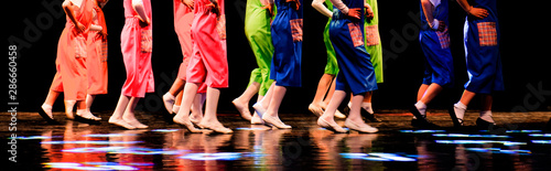 Children run on stage, theatrical performance