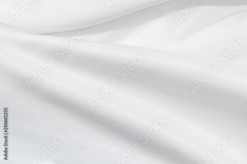Soft focus white silk fabric texture background