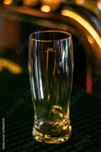 empty glass on dark wooden table