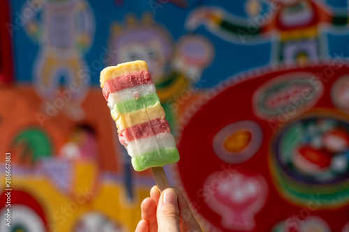 Rainbow popsicle sell at Rainbow village, colourful graffiti painted on house. A travel destination people can view colorful paintings and illustrations on the walls. Taichung, Taiwan