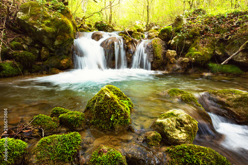 Fototapeta Naklejka Na Ścianę i Meble -  Wild waterfall, deep inside the forest.