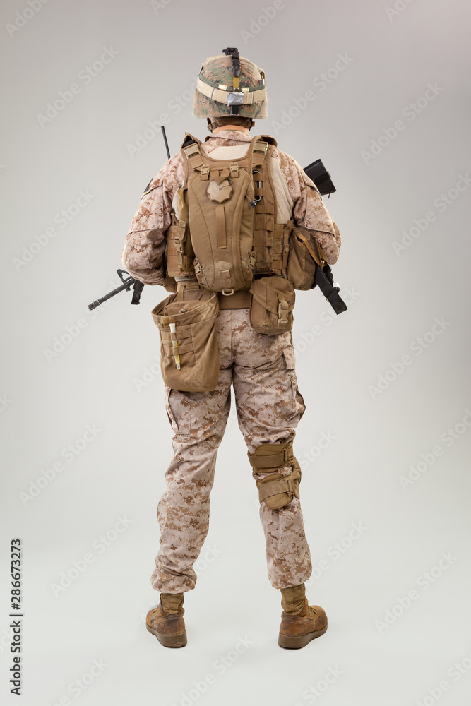 Obraz premium Rear view of military soldier US army marines operator studio shot portrait