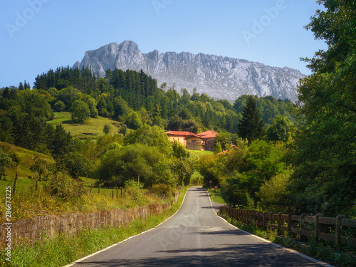 Road to Zaloa village in Orozko with Itxina mountain photo