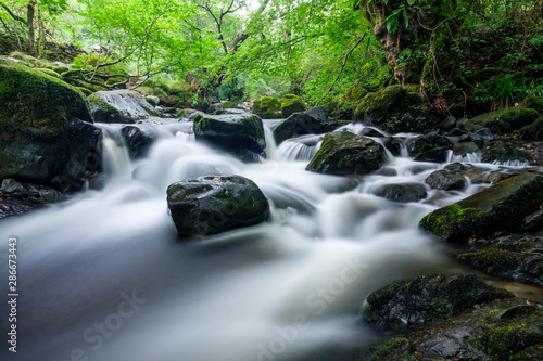 Waterfall running through Lake District, Northern England, UK