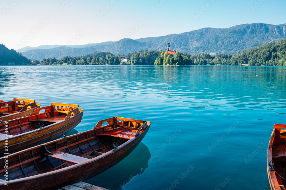 Lake Bled, wooden boat and pilgrimage church of the assumption of maria in Slovenia