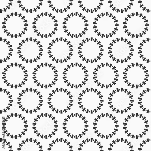 Abstract seamless pattern of repeating round ornaments isolated on white background.