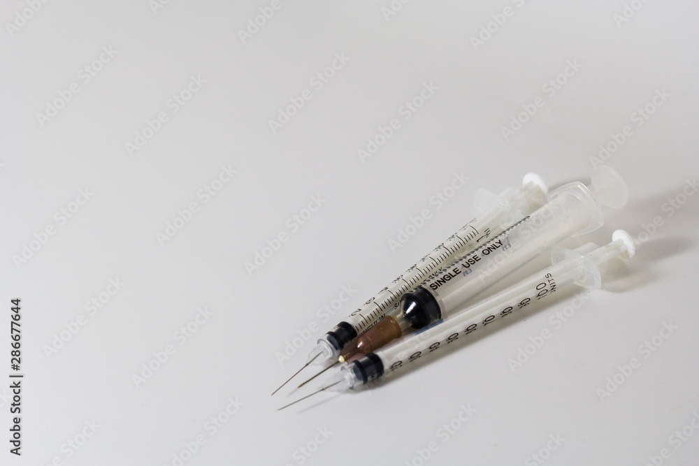Three syringes which are official devices And close-up photography on a white background Three syringes which are official devices And close-up photography on a white background