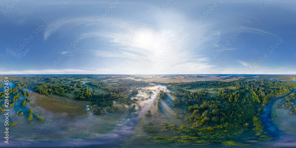 360-degree panoramic aerial view of the field, forest and river covered with a thick layer of morning fog