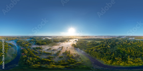 360-degree panoramic aerial view of the field, forest and river covered with a thick layer of morning fog © alexkazachok