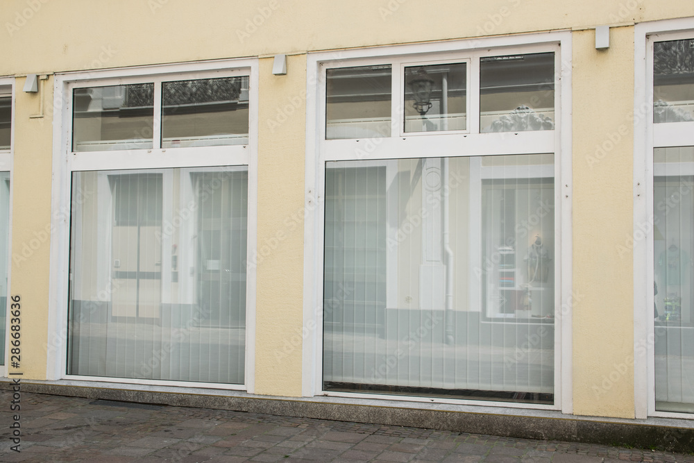 Old empty shop windows in the city.
