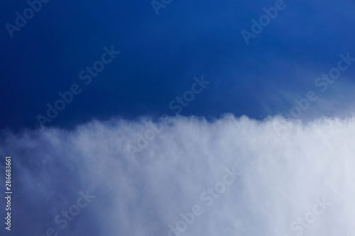 Clear blue sky with white tiny cloud pattern background in sunshine day