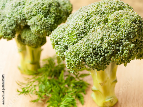 Wallpaper Mural Slices of broccoli cabbage lie on a wooden table Torontodigital.ca