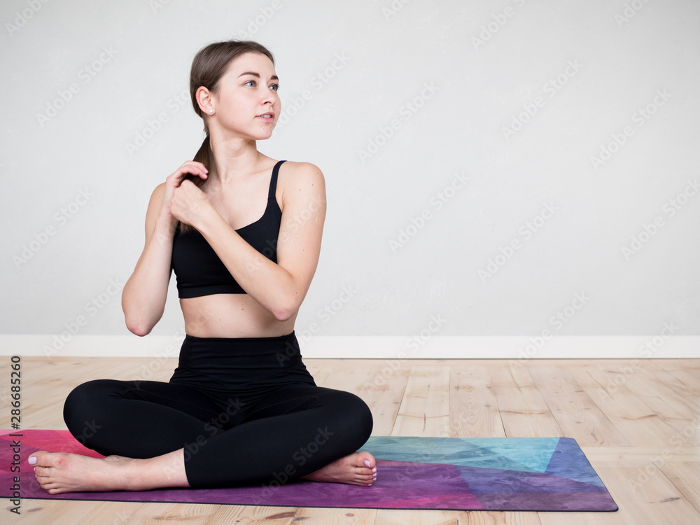 Attractive flexible girl doing yoga exercises Attractive flexible girl doing yoga exercises