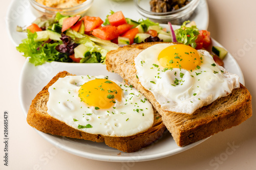 Fried eggs on toasted bread