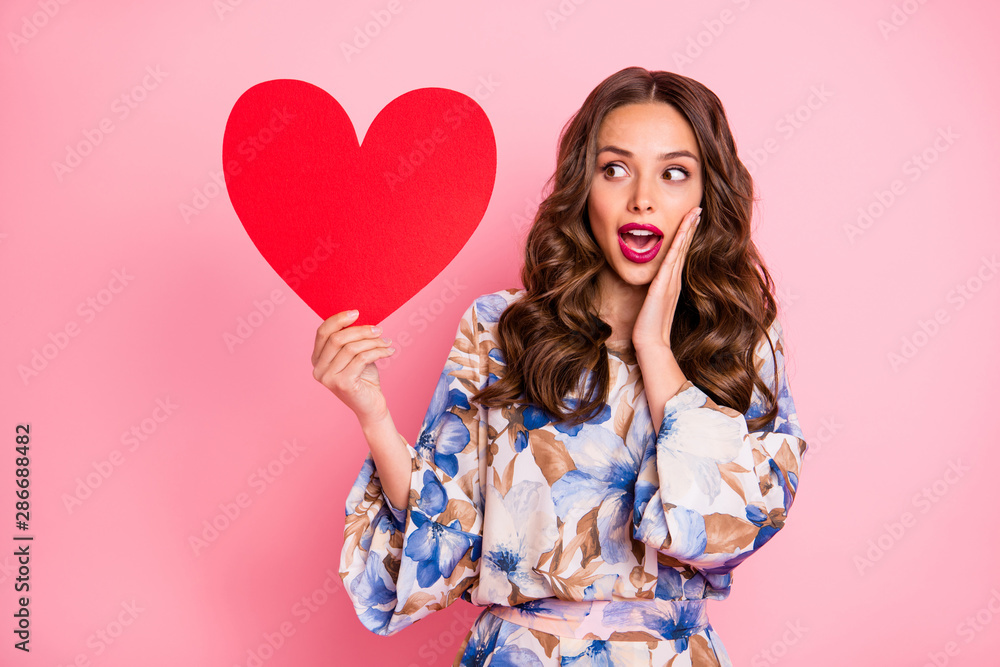 Portrait of her she nice-looking attractive lovely fascinating amazed cheerful cheery glad wavy-haired girl holding in hand large big healthy heart life lifestyle dream isolated over pink background Portrait of her she nice-looking attractive lovely fascinating amazed cheerful cheery glad wavy-haired girl holding in hand large big healthy heart life lifestyle dream isolated over pink background