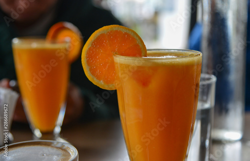 Orange juice on glass cup