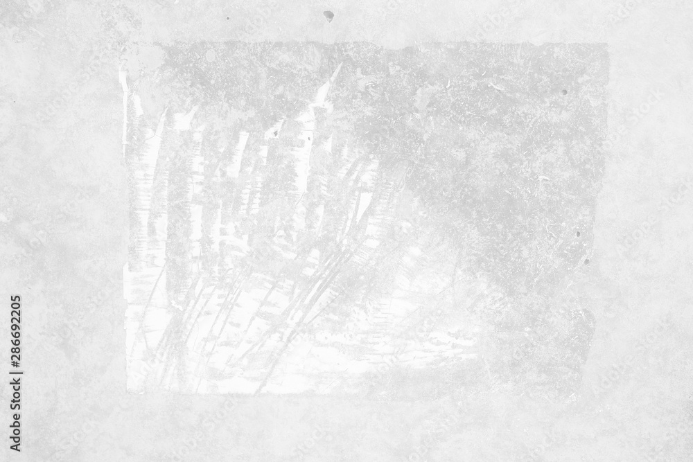 Fototapeta premium Peeling Poster left Glue Adhesive Stain on White Concrete wall.