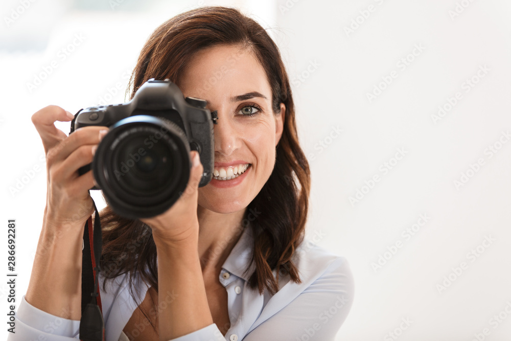 Close up of a beautiful smiling woman photographer Close up of a beautiful smiling woman photographer