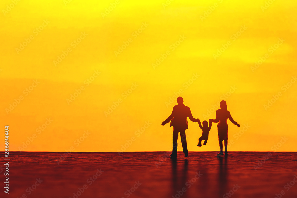 silhouette of miniature couple with text 2020  over blurred sunset background image for Happy new year 2020 or love family concept.