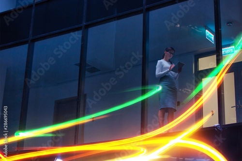 Low angle view of businesswoman working late at office