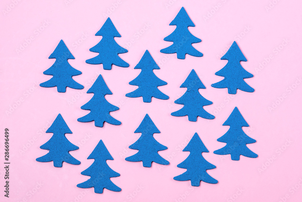Blue Christmas Tree on Light Pink Background Top View Flat Lay Christmas Card or Background Minumal Concept Holiday Concept