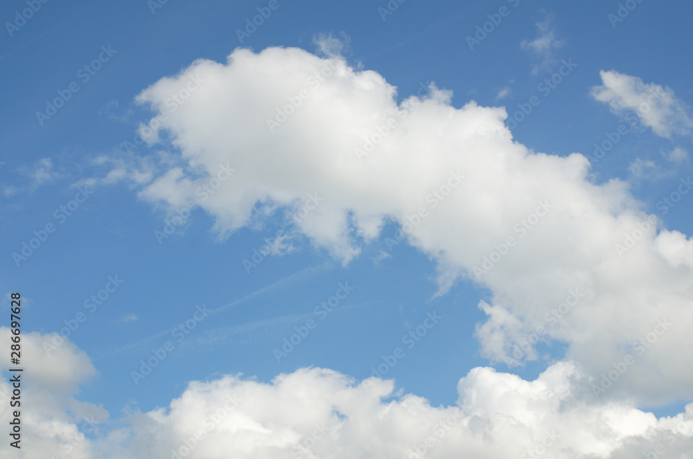 Cloudy sky, cumulus clouds lights in sun rays Cloudy sky, cumulus clouds lights in sun rays