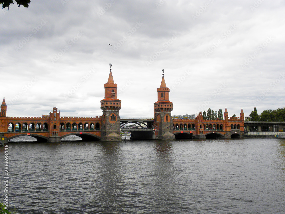 view of the oberbaum bridge on the Spree river in Berlin, Germany