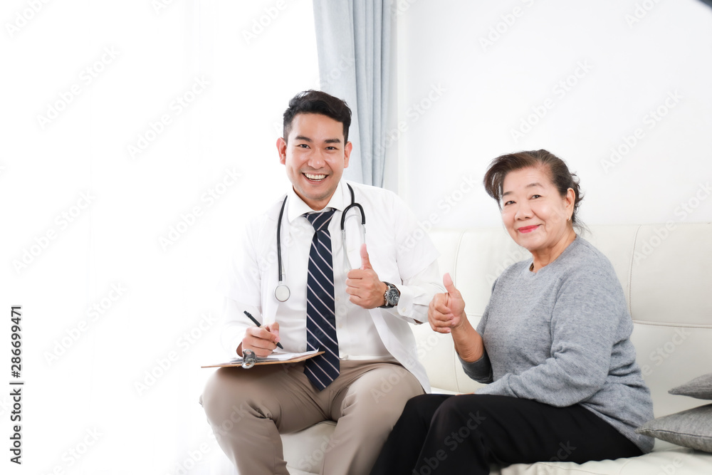 Asian young Doctor talking with Senior woman in hospital Asian young Doctor talking with Senior woman in hospital