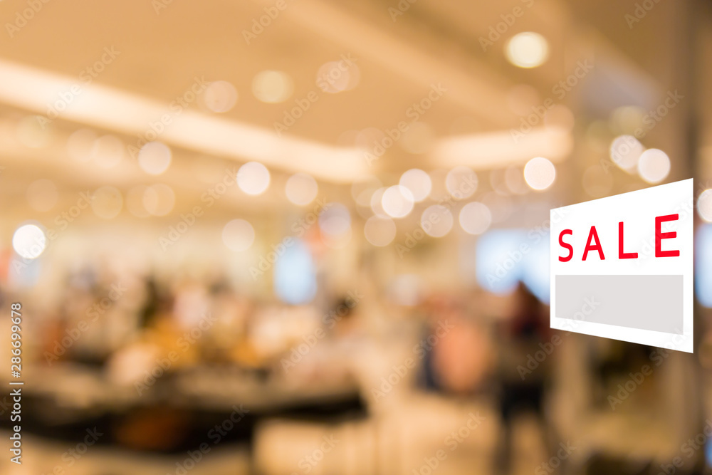 Fototapeta premium Sale signboard with Abstract blurred background of Department store interior.