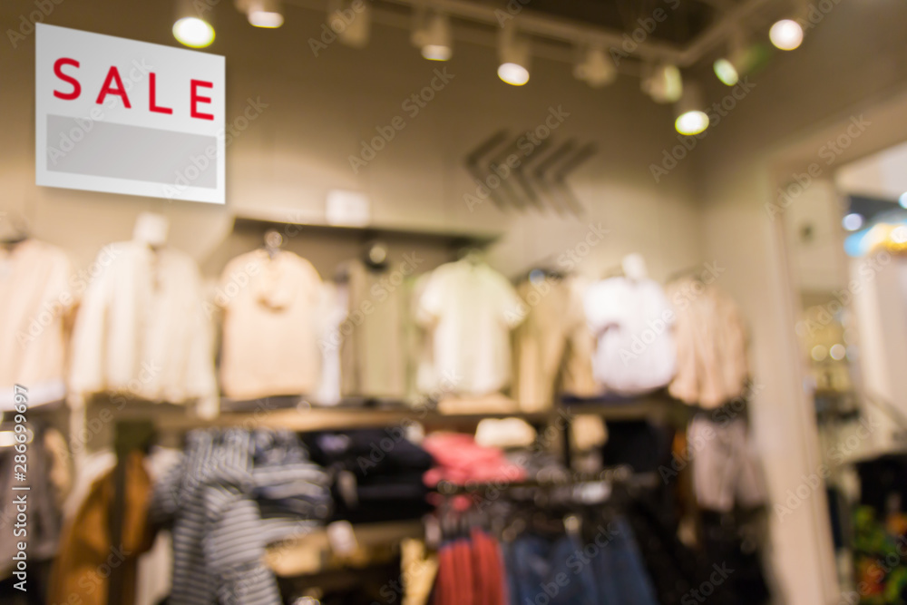 Sale signboard with Abstract blurred background of Department store interior. Sale signboard with Abstract blurred background of Department store interior.