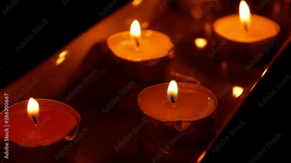beautiful fire of a candle in a dark room a warm yellow light candle , fire of a candle burning in the dark beautiful fire of a candle in a dark room a warm yellow light candle , fire of a candle burning in the dark