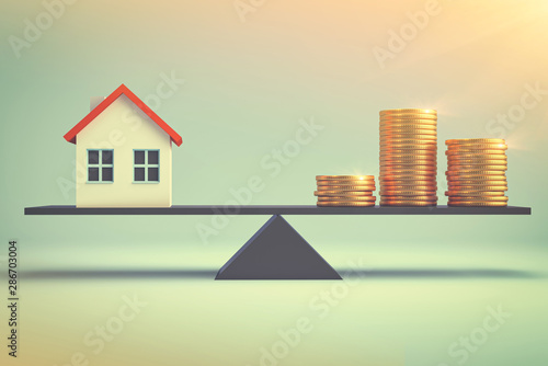 Affordable housing - mortgage stimulus program investment, real estate and property concept - close up home model and Piles of gold coins