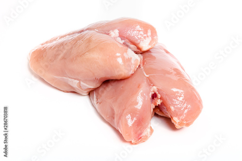 Raw fillet of chiken breast on a light background