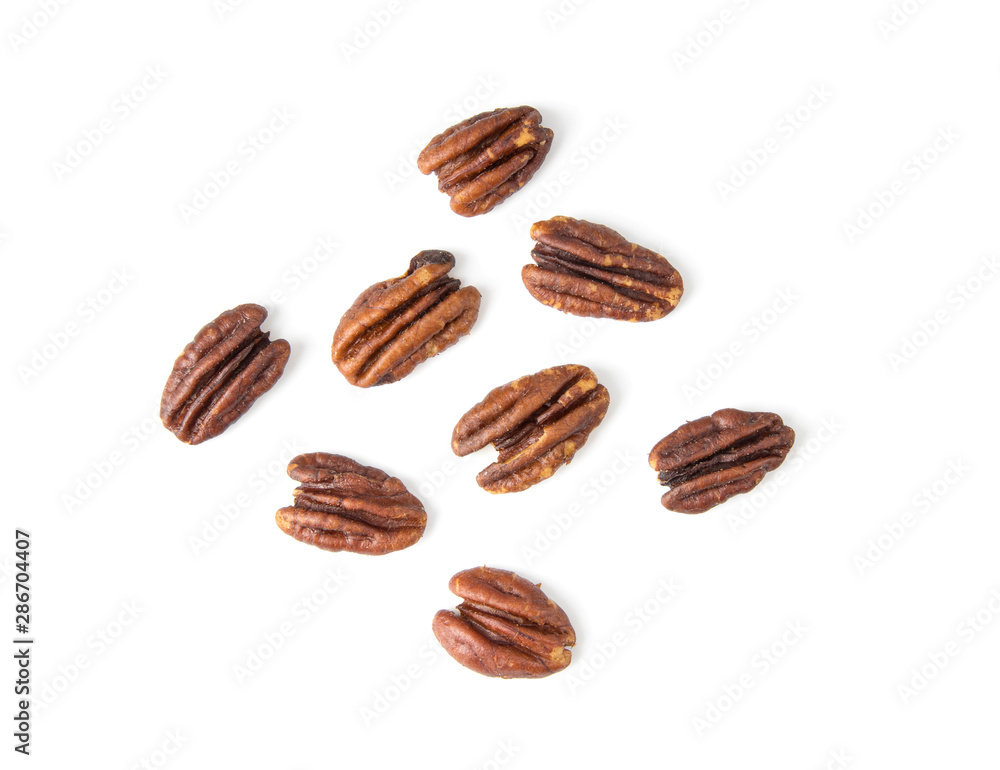 Pecan nuts topped with light salt isolated on white background . top view Pecan nuts topped with light salt isolated on white background . top view
