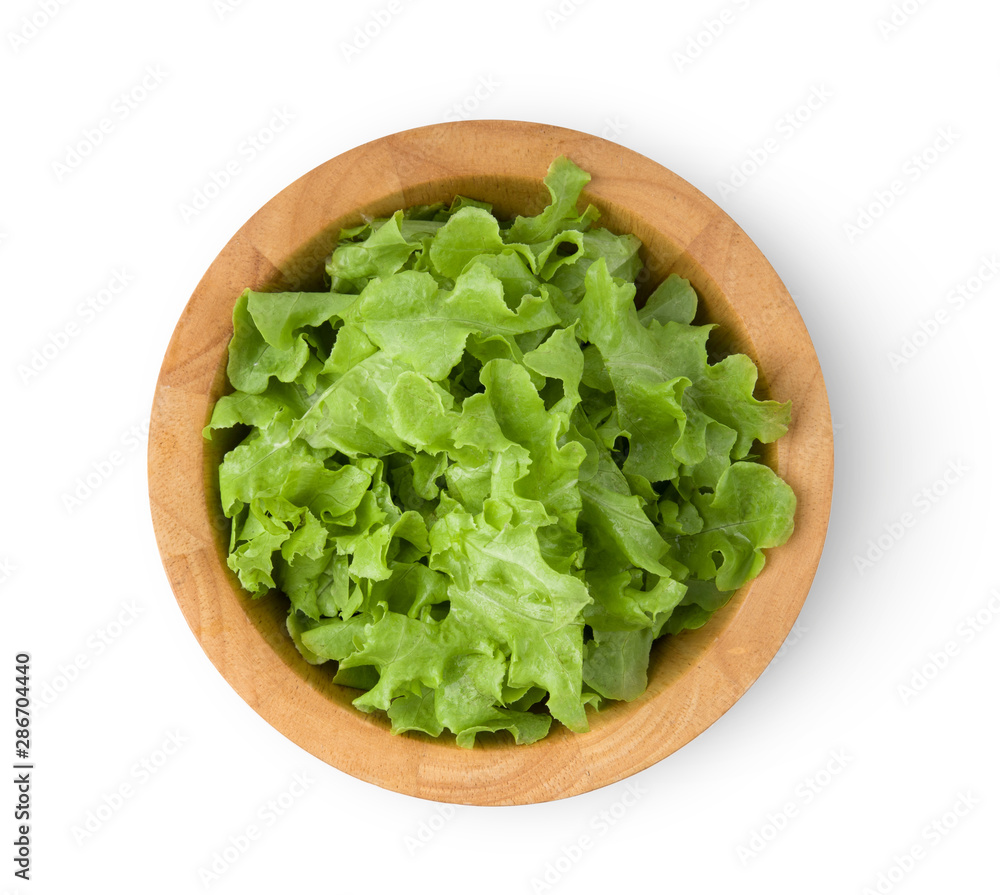 lettuce leaf in wood bowl isolated on white background. top view lettuce leaf in wood bowl isolated on white background. top view