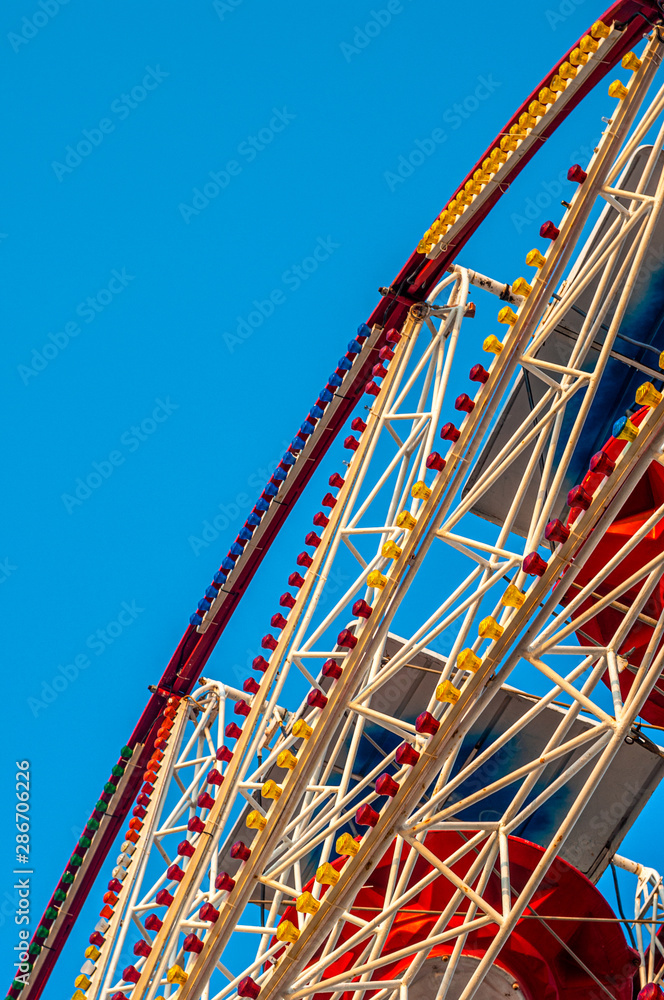 Luna Park Wheel with bluy sky background photography from ground
