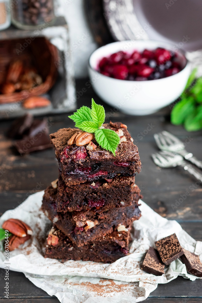 Chocolate brownie with berries and nuts