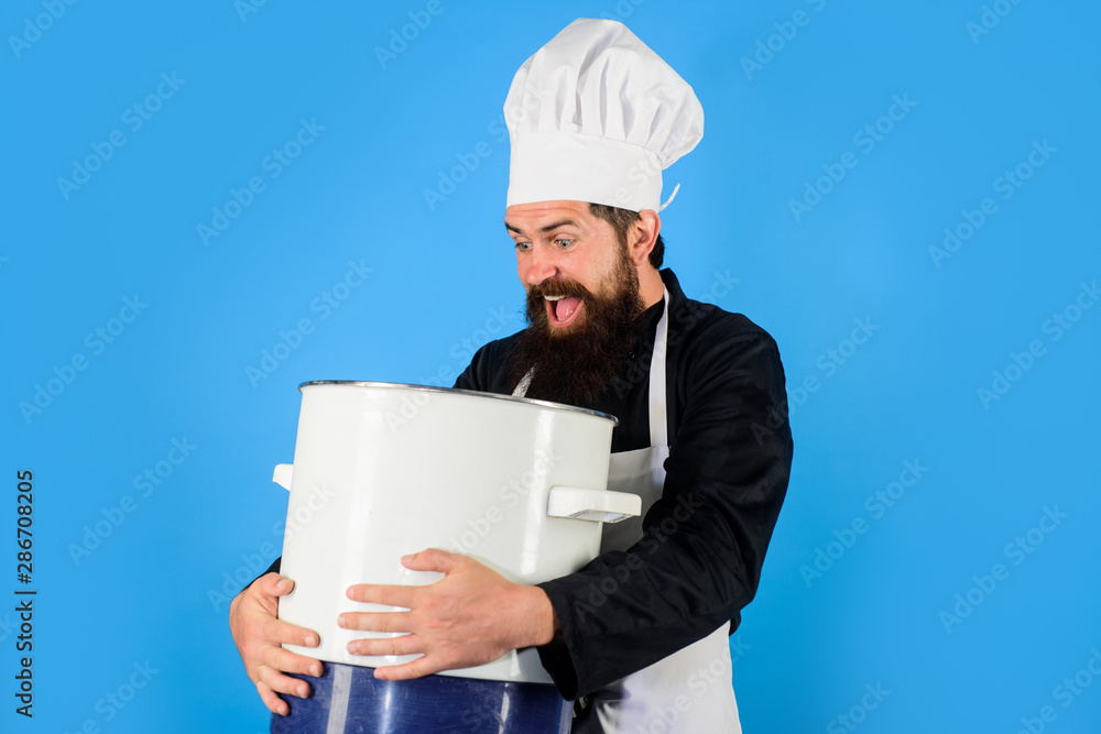 Cook with big cooking pot in the kitchen, Stock Photo, Picture And