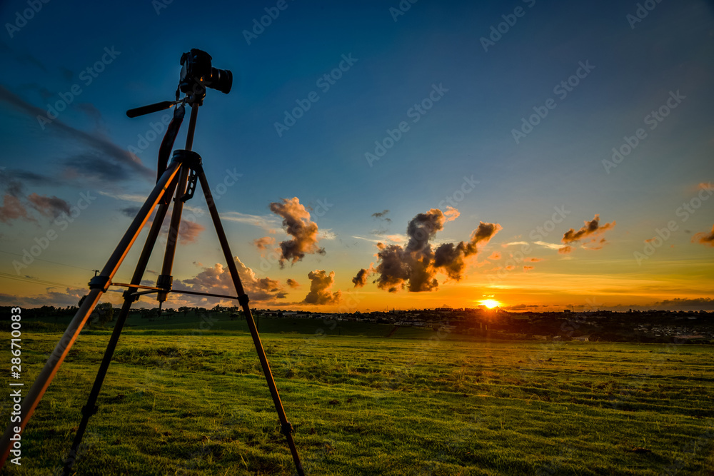 Photo of the sunset. Beautiful evening. Photo of a machine and a tripod. Calm down.