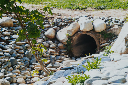 drain pipe or effluent or sewer release wastewater into river. Sewage or domestic wastewater or municipal wastewater