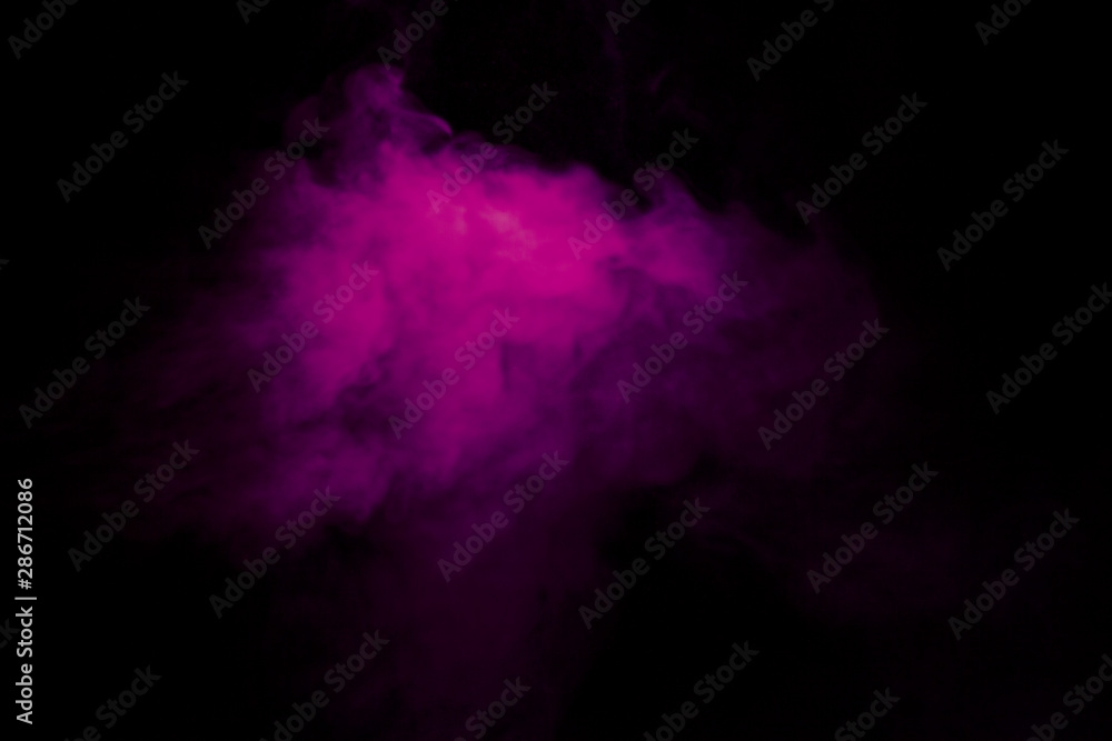 Jet of smoke on black background. Selective focus. Toned Jet of smoke on black background. Selective focus. Toned