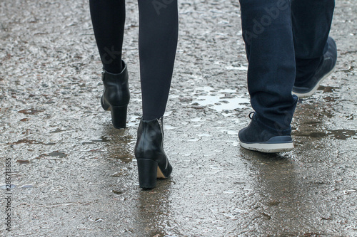 Legs on wet pavement.