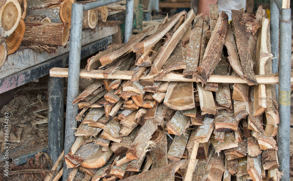 Stack of lumber woods in the steel container at wood factory or sawmill. Stack of lumber woods in the steel container at wood factory or sawmill.