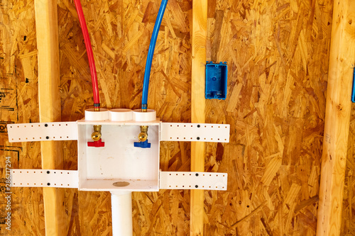 Photography Clothes washer connections and hookup in new home construction