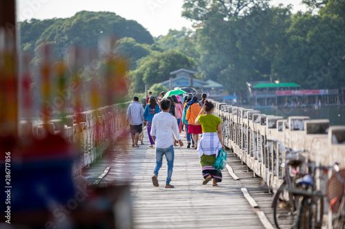 MANDALAY/MYANMAR(BURMA) - 30th July, 2019 : U BEIN BRIDGE is one of the famous teakwood bridge in the world. Located in Mandalay, Myanmar. photo