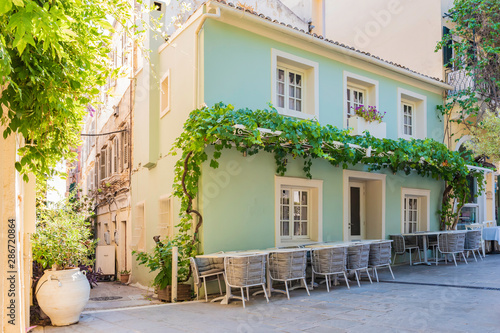 Fototapeta Naklejka Na Ścianę i Meble -  Terraces of cafes in the Greek streets