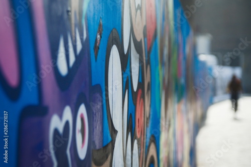 Graffiti on the wall in the city with shallow depth of field blurry background